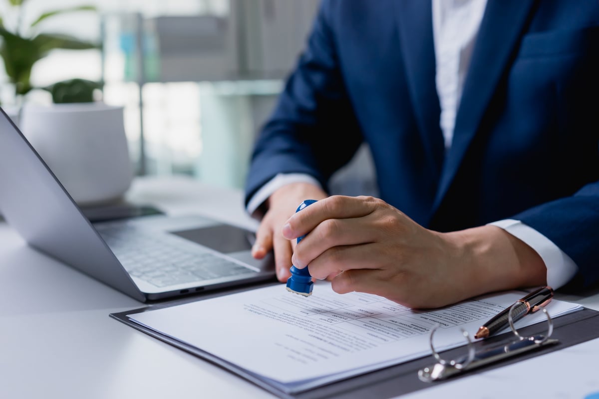 Official U.S. documents and certification paperwork on a professional desk